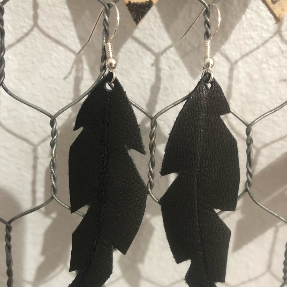 Black leather feather earrings